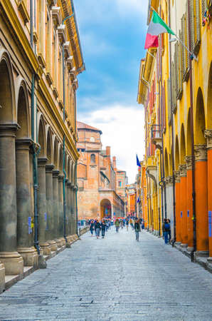 Bologna, Italy, March 17, 2018: typical italian street, buildings with columns, Convento Padri Agostiniani on Piazza Giuseppe Verdi square background in old historical city centre, Emilia-Romagnaのeditorial素材