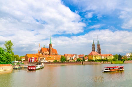Wroclaw, Poland, May 7, 2019: Panoramic view of Ostrow Tumski: Collegiate Church Holy Cross and St....