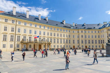 Prague, Czech Republic, May 13, 2019: courtyard square with The Archive of the Prague Castle and Old Royal Palace buildings, walking people tourists, Mala Strana Lesser Town, Bohemiaのeditorial素材