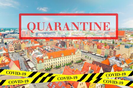 Quarantine in Poland. Top aerial panoramic view of Wroclaw old town. No travel and lockdown concept. Coronavirus outbreak Covid-19 pandemic concept. Canceled tourist vacation. Barrier tape.の写真素材