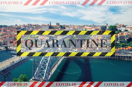Quarantine in Portugal. Ponte Dom Luis across Douro river in Porto. No travel and lockdown concept. Coronavirus outbreak Covid-19 pandemic concept. Canceled tourist vacation. Barrier tape.の写真素材
