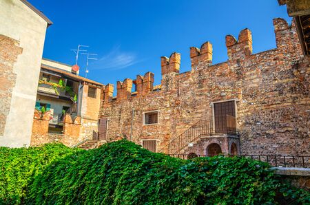 Teatro Nuovo theatre brick wall with merlons from Juliet balcony of Casa di Giulietta Juliet Capulet house in Verona city historical centre Citta Antica, Veneto Region, Northern Italyの写真素材