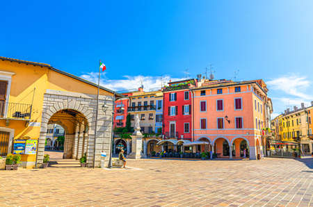 Desenzano del Garda, Italy, September 11, 2019: Vintage Antique market place and Angela Merici monument on Piazza Giuseppe Malvezzi square in historical town centre, blue sky background, Lombardyのeditorial素材