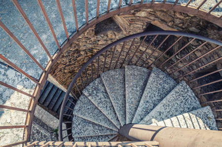 Desenzano del Garda, Italy, September 11, 2019: Spiral staircase with stairs of old medieval castle Castello, Lombardy, Northern Italyのeditorial素材