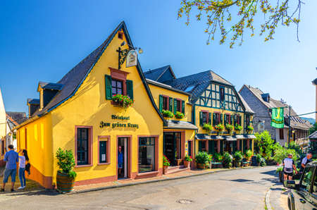 Rudesheim am Rhein, Germany, August 24, 2019: Traditional german houses and beautiful art buildings with typical wooden wall fachwerk style in historical medieval town centre, State of Hesseのeditorial素材
