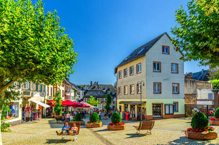 Rudesheim am Rhein, Germany, August 24, 2019: cobblestone square and traditional german houses and...