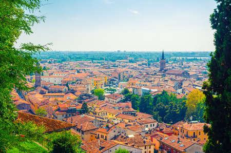 Aerial view of Verona historical city centre, catholic church of San Tomaso Cantuariense, medieval buildings with red tiled roofs in Veronetta, Veneto Region, Italy. Verona cityscape, panoramic view.の写真素材