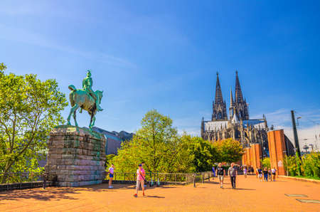 Cologne, Germany, August 23, 2019: Cathedral Roman Catholic Church Saint Peter gothic architectural style building and Equestrian Statue of Kaiser Wilhelm II monument in historical city centerのeditorial素材