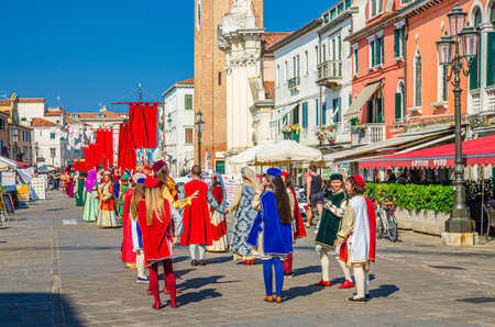 Chioggia, Italy, September 16, 2019: people actors take part in film shooting, mass scene movie making in street of historical town center with old colorful multicolored buildings, Veneto Regionのeditorial素材