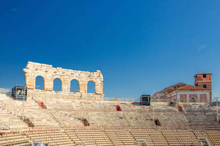 Verona, Italy, September 12, 2019: Verona Arena interior inside view with stone stands. Roman amphitheater Arena di Verona ancient building, sunny day, blue sky, historical city center, Veneto Regionのeditorial素材