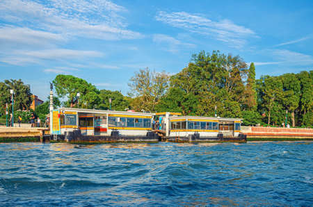 Venice, Italy, September 14, 2019: Giardini Biennale boat stop for vaporetto boats near Giardini Della Biennale gardens in Castello sestiere, view from water of Venetian lagoon, Veneto regionのeditorial素材