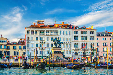 Venice, Italy, September 14, 2019: Monumento a Vittorio Emanuele II monument, Hotel Londra Palace building and Riva degli Schiavoni waterfront embankment with moored gondolasのeditorial素材