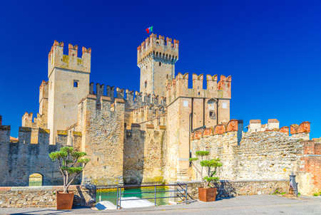 Scaligero Castle Castello di Sirmione fortress from Scaliger era in historical center of Sirmione town on Garda lake, medieval castle with stone towers and brick walls, Lombardy, Northern Italyのeditorial素材