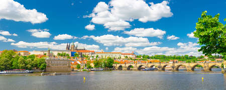 Panorama of Prague city historical centre with Prague Castle, St. Vitus Cathedral in Hradcany district, Charles Bridge Karluv Most across Vltava river. Panoramic view of Prague city, Czech Republicの写真素材