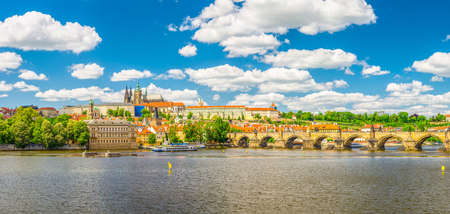 Panorama of Prague city historical center with Prague Castle, St. Vitus Cathedral in Hradcany district, Charles Bridge Karluv Most across Vltava river. Panoramic view of Prague city, Czech Republicの写真素材