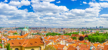 Panorama of Prague historical city center with dome of Saint Nicholas catholic Church, red tiled roof buildings in Mala Strana Lesser Town and Old Town, aerial panoramic view, Bohemia, Czech Republicの写真素材