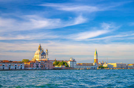 Venice cityscape with San Marco basin of Venetian lagoon water, Santa Maria della Salute church, Campanile bell tower and Doge's Palace Palazzo Ducale building, Veneto Region, Italyの写真素材