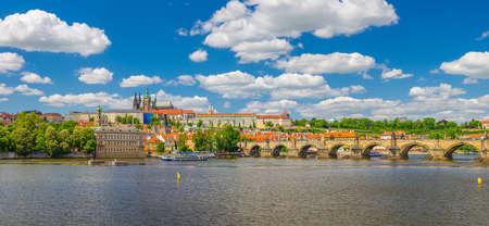 Panorama of Prague city historical center with Prague Castle, St. Vitus Cathedral in Hradcany district, Charles Bridge Karluv Most across Vltava river. Panoramic view of Prague city, Czech Republicの写真素材