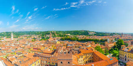 Aerial panoramic view of Verona city historical center Citta Antica with red tiled roof buildings. Panorama of Verona town cityscape. Blue sky background copy space. Veneto Region, Northern Italyの写真素材