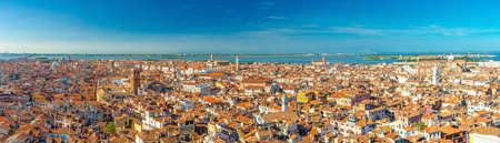 Aerial panoramic view of Venice city old historical city center, buildings with red tiled roofs, San Giuliano Mestre and blue sky background, Veneto Region, Northern Italy. Amazing Venice cityscape.の写真素材