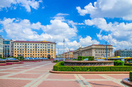 Minsk, Belarus, July 26, 2020: Independence square and Avenue with Socialist Classicism Stalin Empire style buildings and Hotel Minsk in city center, blue sky white clouds in sunny summer dayのeditorial素材