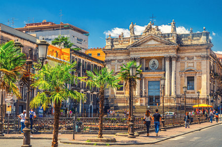 Italy, Catania, May 12, 2018: Roman Amphitheater Anfiteatro Romano and Chiesa San Biagio in Sant'Agata alla Fornace church on Piazza Stesicoro square in Catania historical city center, Sicily islandのeditorial素材