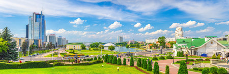 Minsk, Belarus, July 26, 2020: panorama of Minsk city with skyscrapers on Pobediteley Peramohi Avenue in Nemiga district near embankment of Svislach river, blue sky white clouds in sunny summer dayのeditorial素材