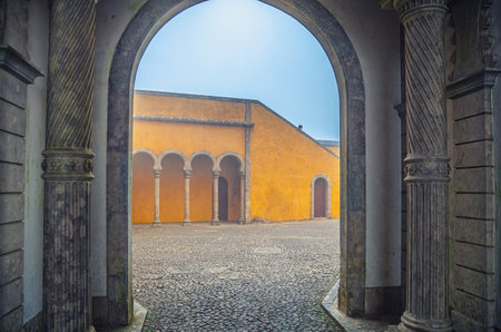 Sintra, Portugal, June 14, 2017: cobblestone courtyard of Pena Palace with arches and columns, Palacio Nacional da Pena Romanticist castle in Sao Pedro de Penaferrimのeditorial素材