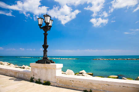 Watercolor drawing of embankment promenade Imperatore Augusto with street light and view of Adriatic sea in Bari cityの写真素材