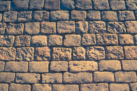 Watercolor drawing of Cobblestone pavement background with copy space. Abstract old close-up cobble stone texture. Pavingstone patterned street view from above, paving tiles.の写真素材