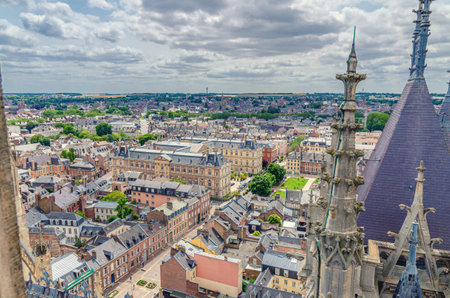 Aerial view from top of Amiens Cathedral with fleche spire and panorama of Amiens old historical city center and outskirts districts, Somme department, Hauts-de-France Region, Northern Franceの写真素材