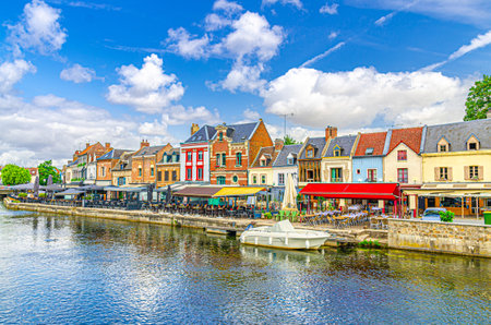 Amiens cityscape old town Saint-Leu quarter, embankment promenade Quai Belu of Somme river water canal with street restaurants, typical buildings in historical city centre, Somme department, Franceの写真素材