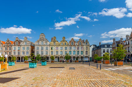 Flemish-Baroque-style townhouses buildings on La Grand Place square in Arras historical city center, blue sky in summer day, Artois, Pas-de-Calais department, Hauts-de-France Region, Northern Franceの写真素材