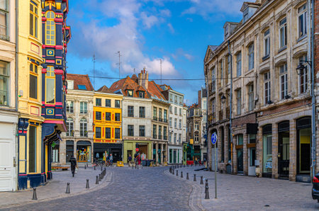 Vieux Lille old town quarter with empty narrow cobblestone street, paving stone square with old colorful buildings in historical city centre, Nord department, Hauts-de-France Region, Northern Franceの写真素材