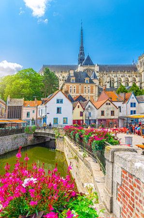 Amiens old town with old houses, water canal and Amiens Cathedral Basilica of Our Lady Notre-Dame in historical city centre, Picardy, Somme department, Hauts-de-France Region, Northern Franceの写真素材