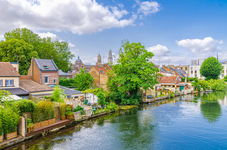 Courtyard of residential houses on bank of water canal of River Somme in Amiens city near Hortillonnages floating gardens jardins flottants, Somme department, Hauts-de-France Region, Northern Franceの写真素材