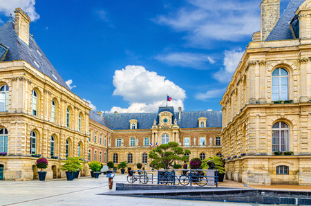 Amiens City hall Hotel de ville is a town hall neo-classical architecture style stone brick building with French flag in Amiens old historical city centre, Somme department, Hauts-de-France Regionの写真素材