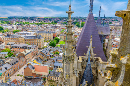 Aerial view from top of Amiens Cathedral with fleche spire and panorama of Amiens old historical city center and outskirts districts, Somme department, Hauts-de-France Region, Northern Franceの写真素材