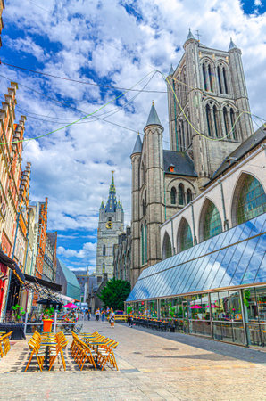 Ghent city historic center with Saint Nicholas Church on Korenmarkt Wheat Market square, Belfry Belfort van Gent and traditional buildings in old town, East Flanders province, Flemish Region, Belgiumの写真素材