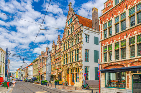 Street with old traditional houses and buildings with stepped gables in Ghent historic city center Prinsenhof Princes Court district, Gent old town, East Flanders province, Flemish Region, Belgiumの写真素材