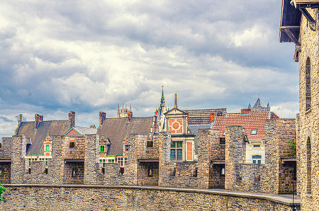 Merlons of The Castle of the Counts Gravensteen medieval castle with stone walls of old buildings in Ghent historical city centre, Gent old town, East Flanders province, Flemish Region, Belgiumの写真素材