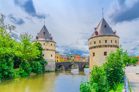 Broeltorens Broel Towers Gothic architecture style stone buildings near Broel Bridge, promenade of Lys river in Kortrijk city historical centre, Fortification towers, West Flanders province, Belgiumの写真素材