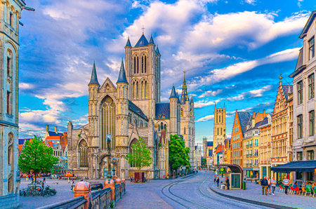 Ghent city historical center with Saint Nicholas Church on Korenmarkt Wheat Market square, Belfry Het Belfort van Gent and row of colorful buildings, East Flanders province, Flemish Region, Belgiumの写真素材
