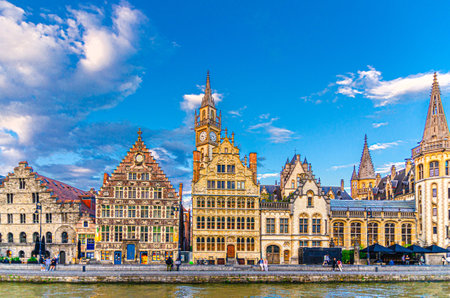 Cityscape of Ghent old town, Graslei Grass Quay with row of historical buildings guild houses on bank of Leie river embankment in Ghent city center, East Flanders province, Flemish Region, Belgiumの写真素材