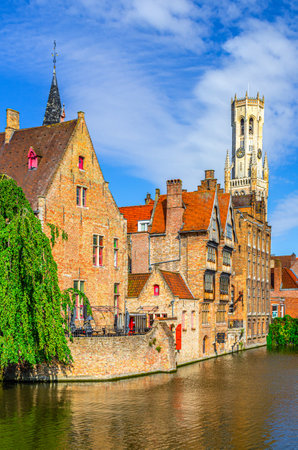 Brugge old town scenic view of historical city center from Rosary Quay Rozenhoedkaai embankment, Boutique Hotel Relais Bourgondisch Cruyce, Dijver water canal, vertical view, Flemish Region, Belgiumの写真素材