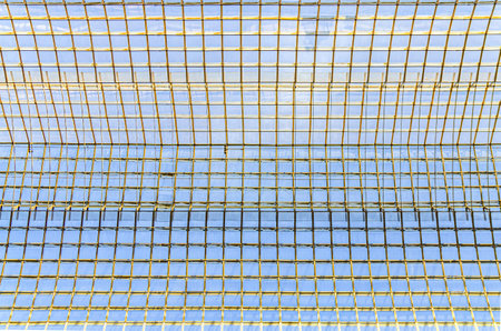 Glass and metal patterned ceiling roof of huge dome of shopping mall skylight, construction transparent window with support system, abstract details, view from below, Brussels city, Belgiumの写真素材