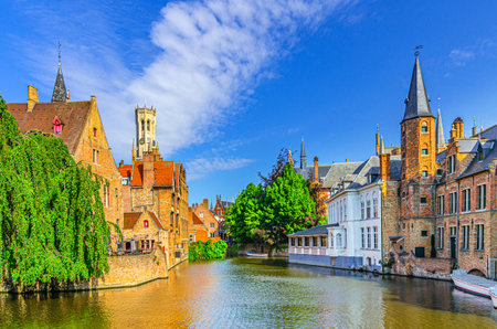 Brugge old town scenic view historical city centre, Rosary Quay embankment with Boutique Hotel, Huis Perez de Malvenda House, De groote Hollander, Belfort Belfry tower, Dijver water canal, Belgiumの写真素材