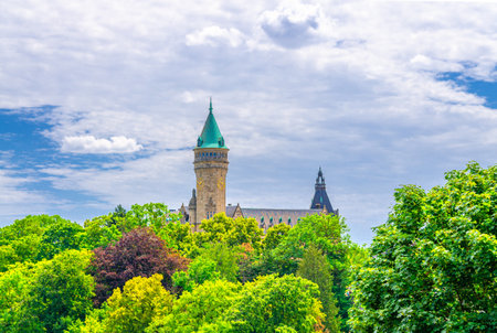 Luxembourg City historical center with Tower of State Bank and Savings Bank, PÃ©trusse Parks green trees and blue sky background in sunny summer dayの写真素材
