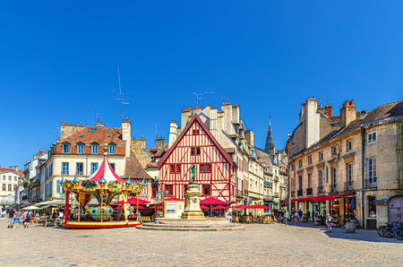 Dijon city historical center with old typical houses colorful buildings and merry-go-round carousel on La Fontaine Place Francois Rude square, cityscape Dijon old town, Bourgogne region, Franceの写真素材