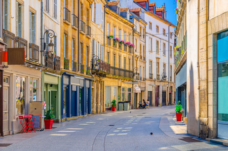 Rue Charrue pedestrian street in Dijon city historical center with stores, shops and old typical houses medieval buildings, Dijon old town in sunny summer day, Bourgogne-Franche-Comte region, Franceの写真素材